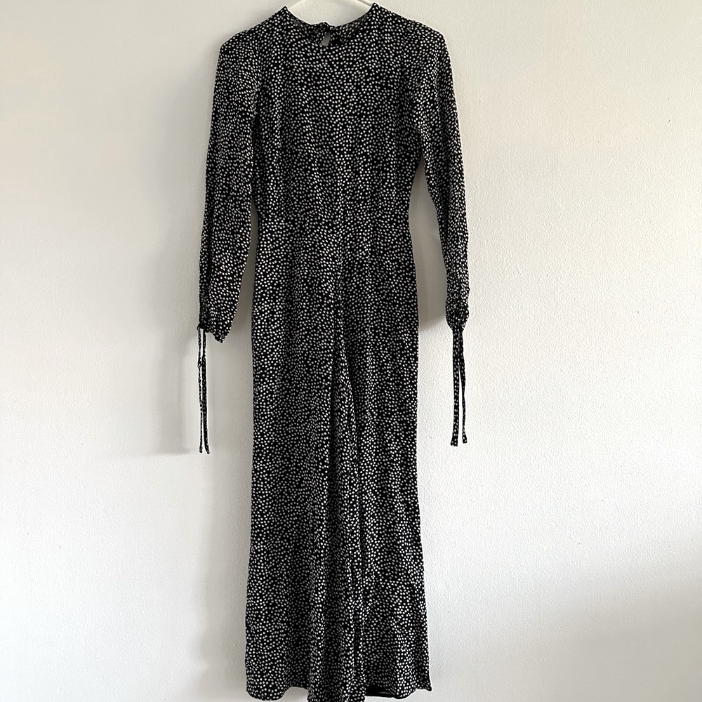 Reformation petites missy jumpsuit in 0P. Black jumpsuit with white flowers.